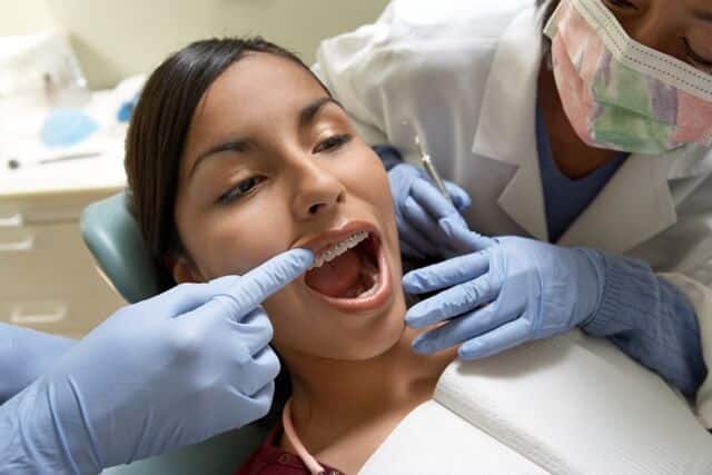 orthodontist treating a patient