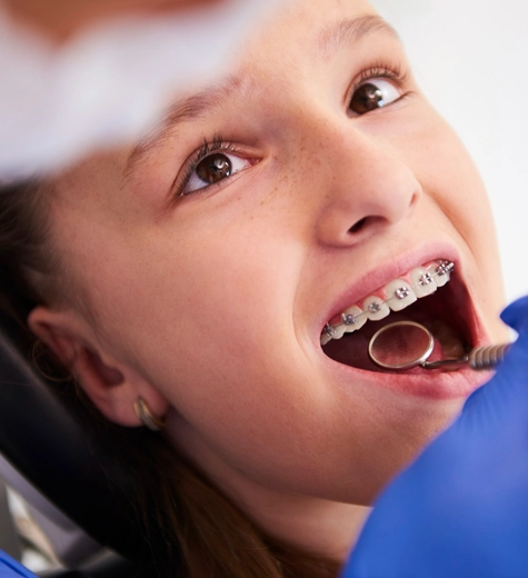 girl-with-braces-during-routine-dental-examination copy